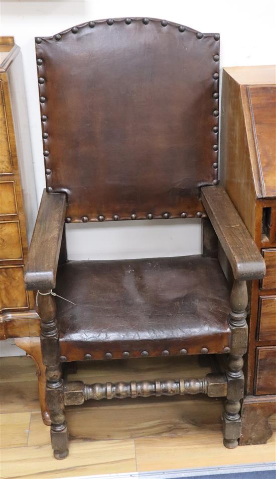 A pair of 18th century style oak elbow chairs
